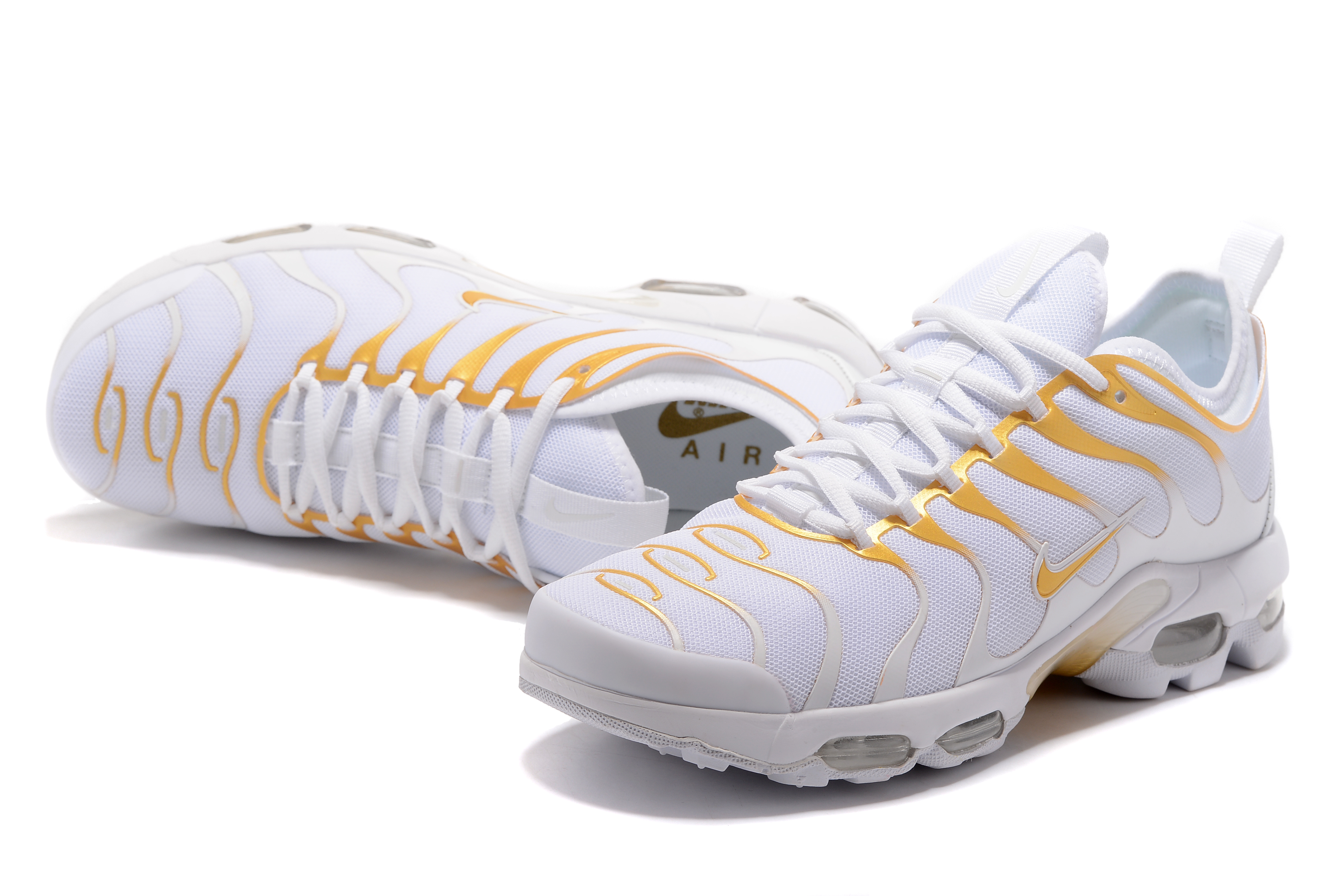 white and gold tns nike