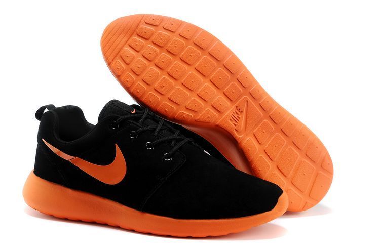black nike shoes with orange swoosh